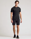 Man wearing 9 All Black Active Quick Dry Shorts 2-Pack.