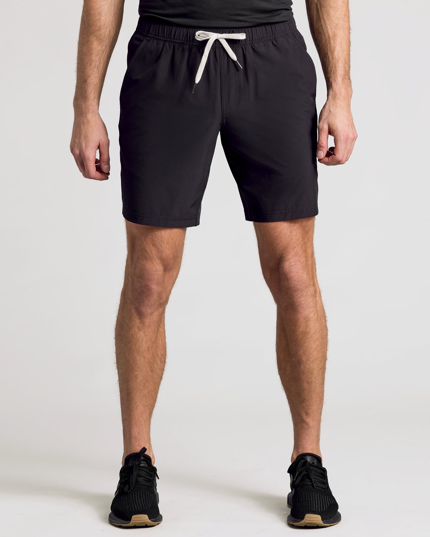 9 All Black Active Quick Dry Shorts on model, showcasing fit and design.