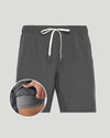 Gray shorts with a drawstring on a light gray background, with a close-up inset showing the waistband.