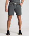 True Classic Men’s Active Shorts - Athletic fit, charcoal-gray, with sneakers.