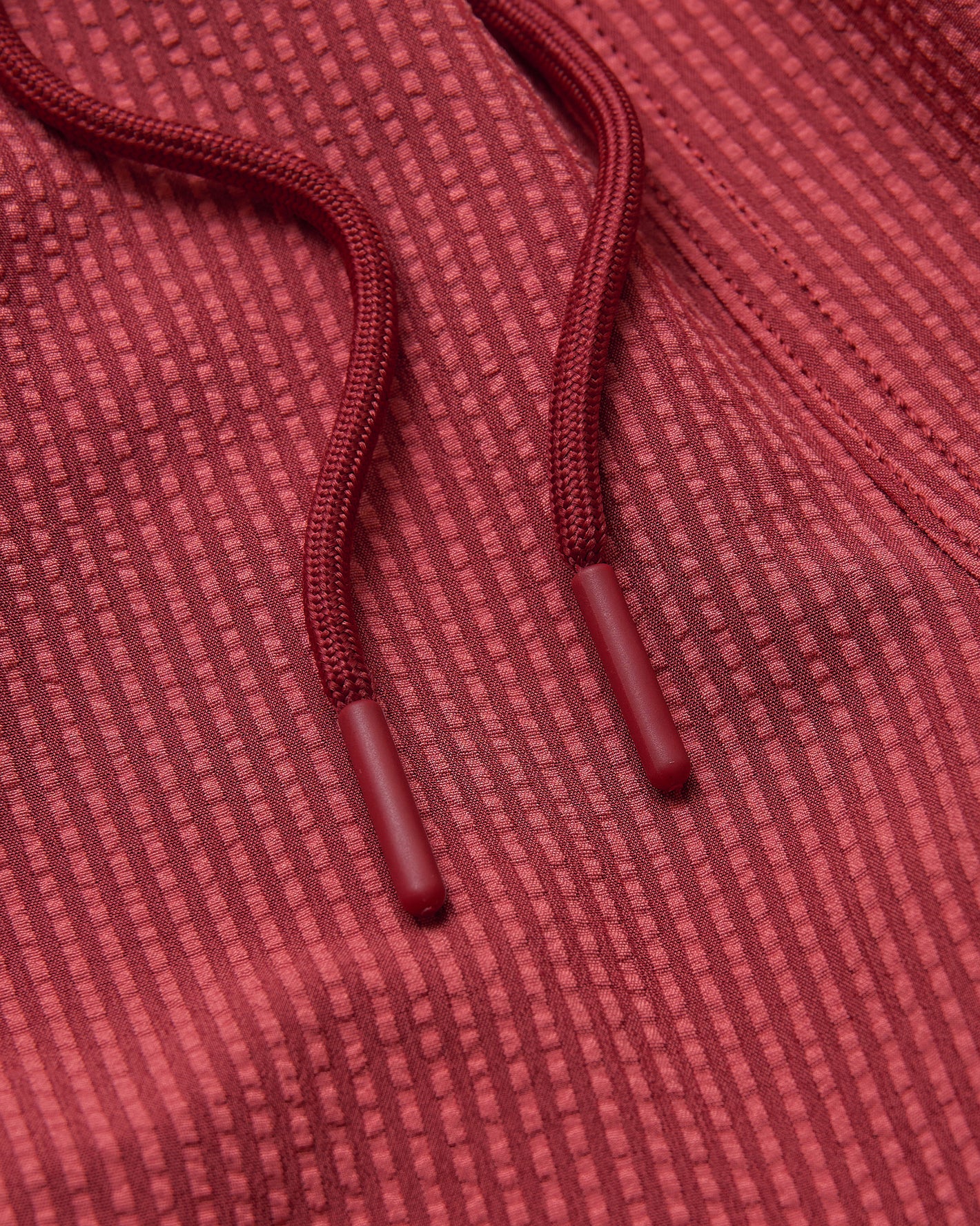 5 Cardinal Seersucker Swim Trunks with textured knit fabric and drawcords.