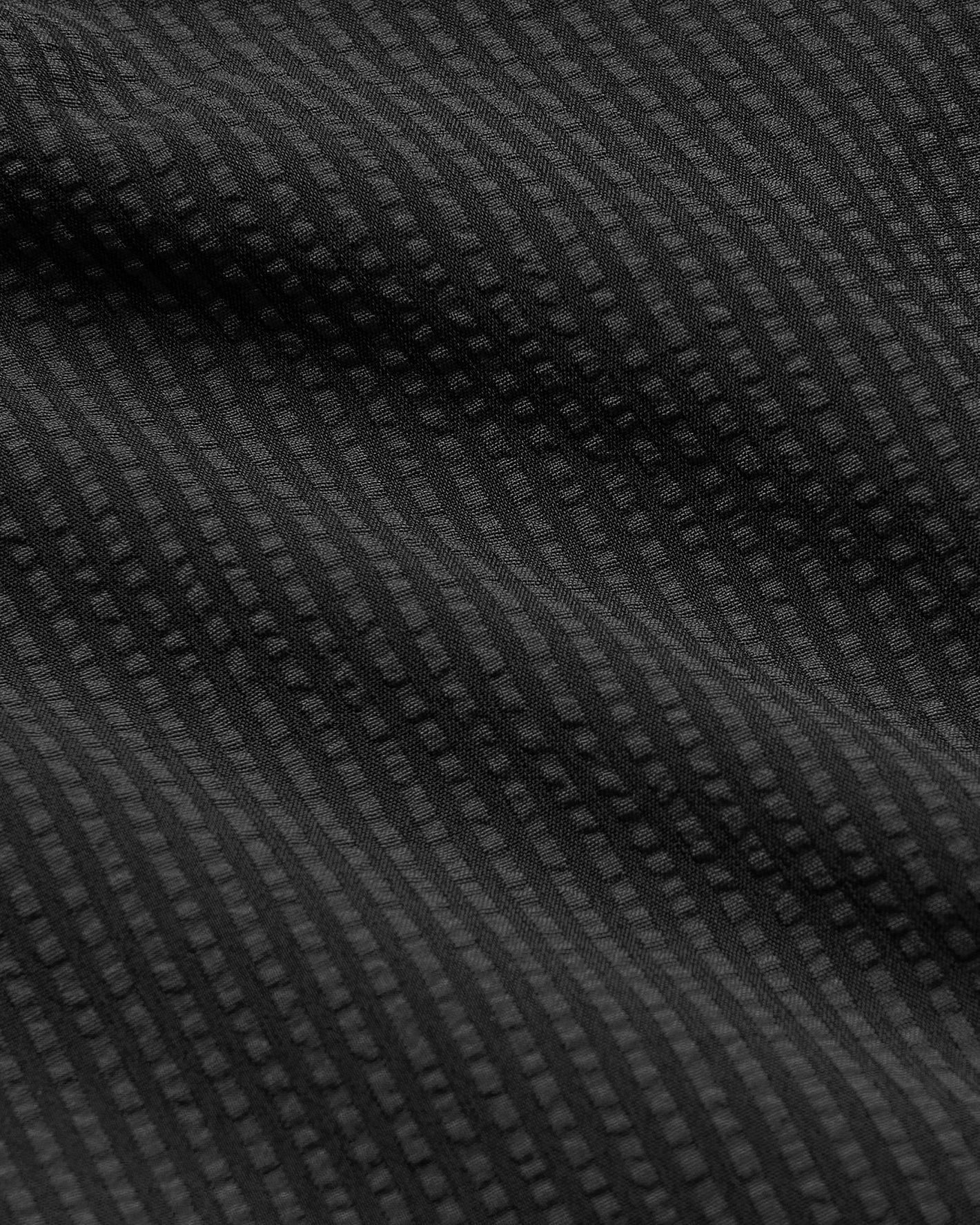 7 Smoke Seersucker Swim Trunks with textured waffle-like fabric.