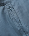 Close-up of 9 Navy & Fiord Linen Shorts' concealed zipper pocket detail.
