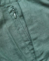 7 Moss Linen Shorts pocket detail with zipper and seam.