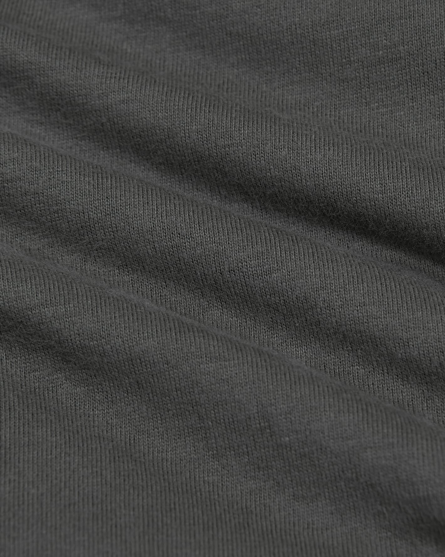 Close-up of dark gray fabric with visible texture