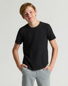 Teen boy in Boys' Classic Curved Hem Crew Neck 6-Pack.
