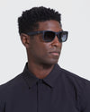 Man in dark shirt wearing Copy Of Classic Polarized Sunglasses.