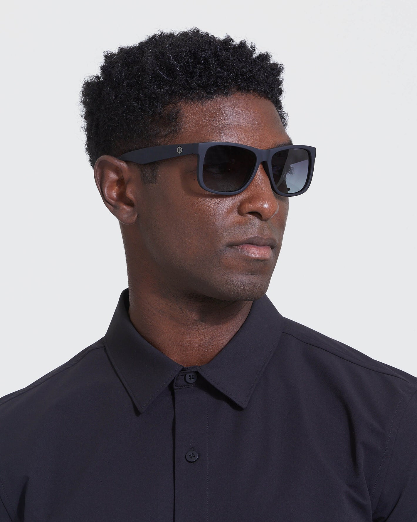 Man in dark shirt wearing Copy Of Classic Polarized Sunglasses.