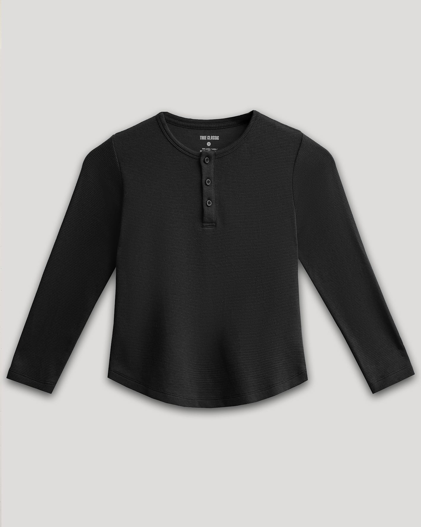 Boys Black Long Sleeve Waffle Henley with textured knit and button placket.
