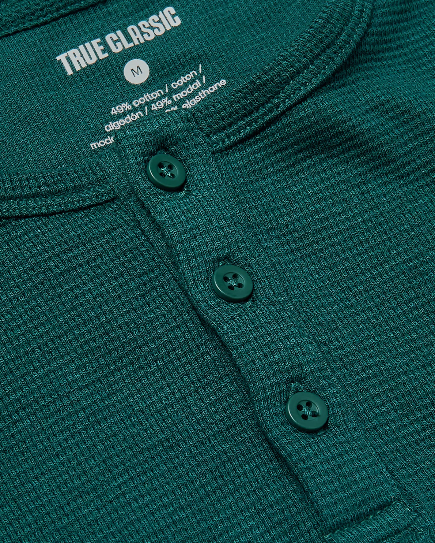 Boys Deep Emerald Long Sleeve Waffle Henley with ribbed texture and buttons.