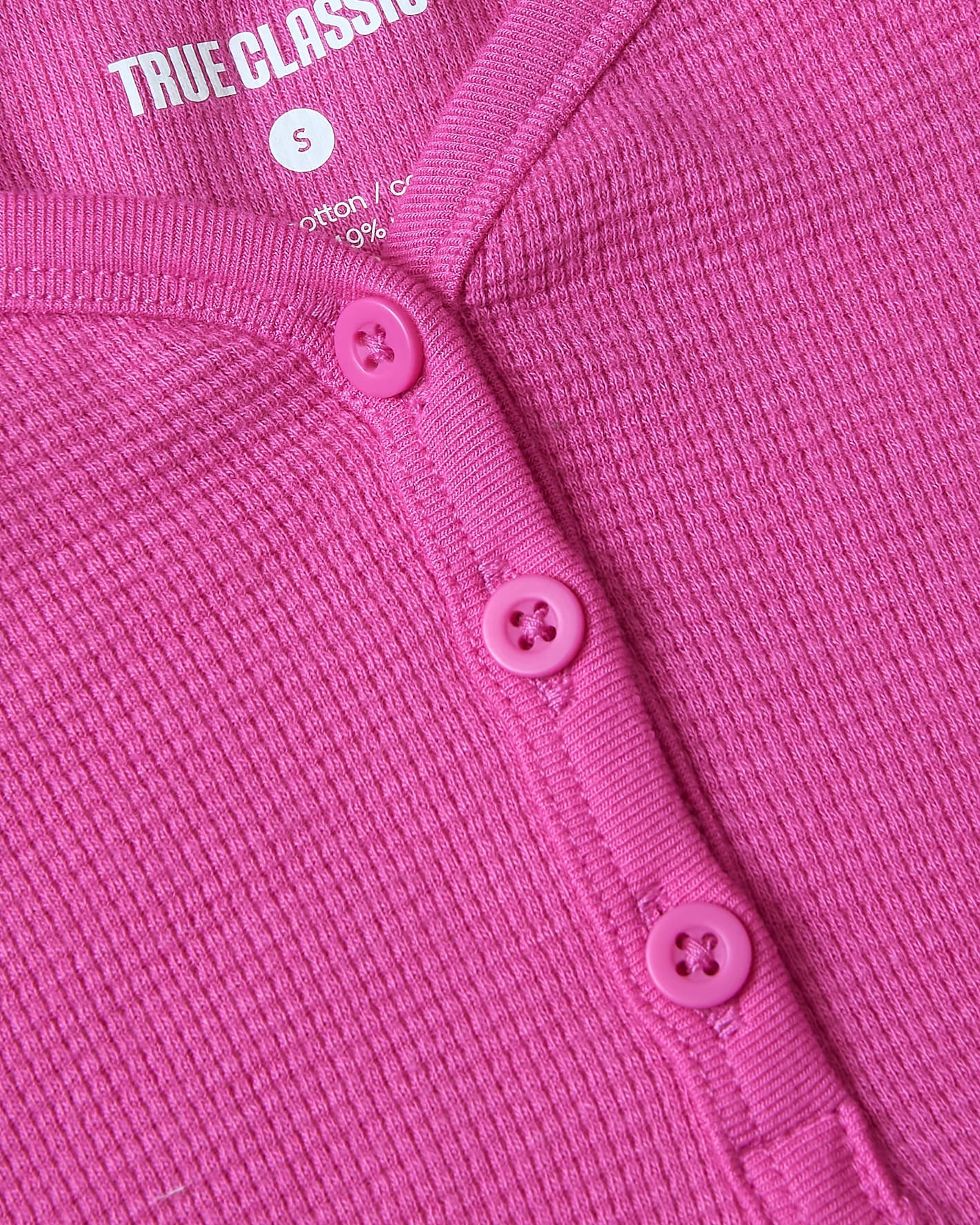 Girls Electric Fuchsia Long Sleeve Boxy Waffle Henley, featuring pink buttons and textured knit.