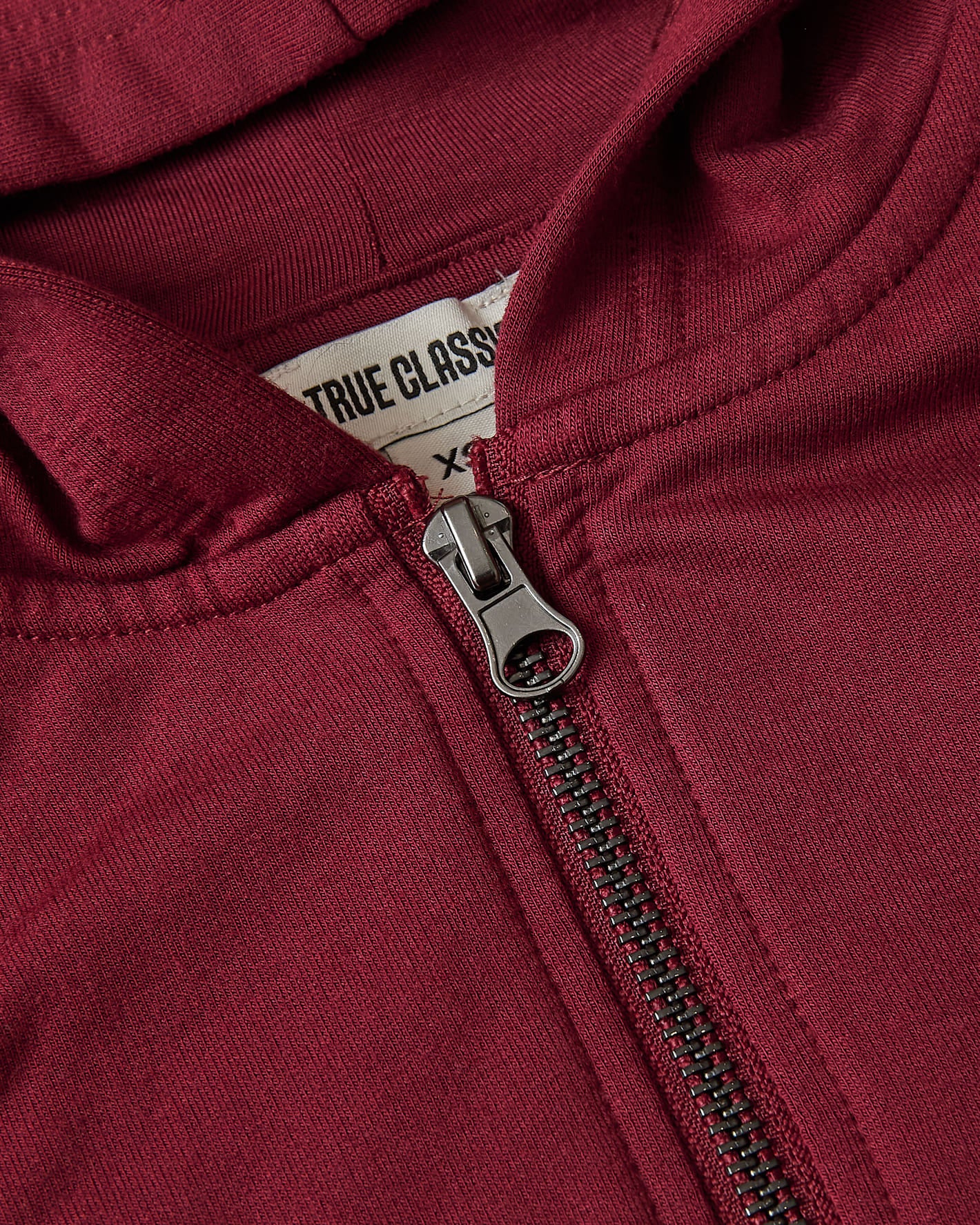 Girls Dark Maroon Cropped Zip Hoodie with metal zipper and “TRUE CLASSIC” tag.