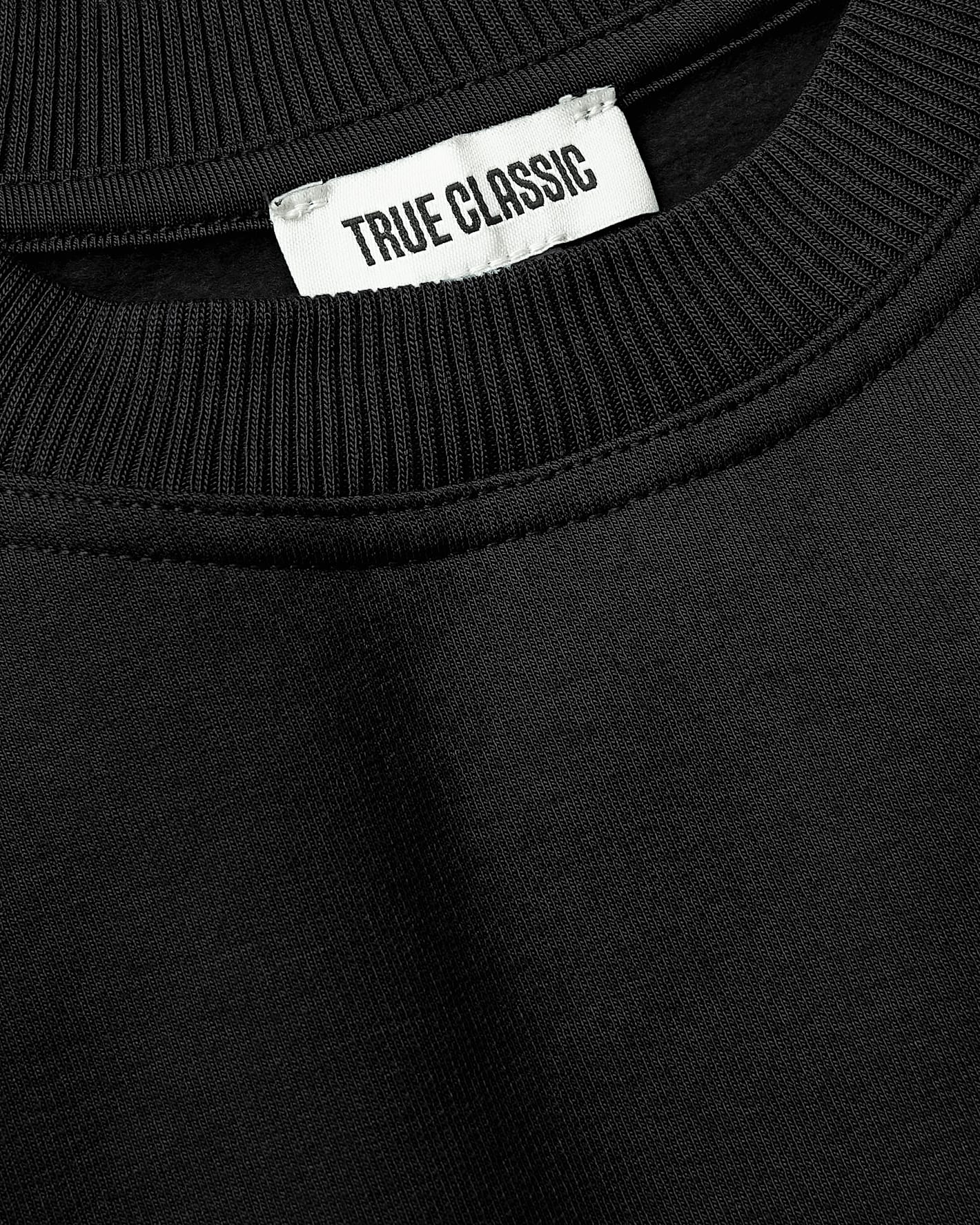 Girls Black & Stormcloud Slouch Pullover Crew neckline with ribbed collar and label.