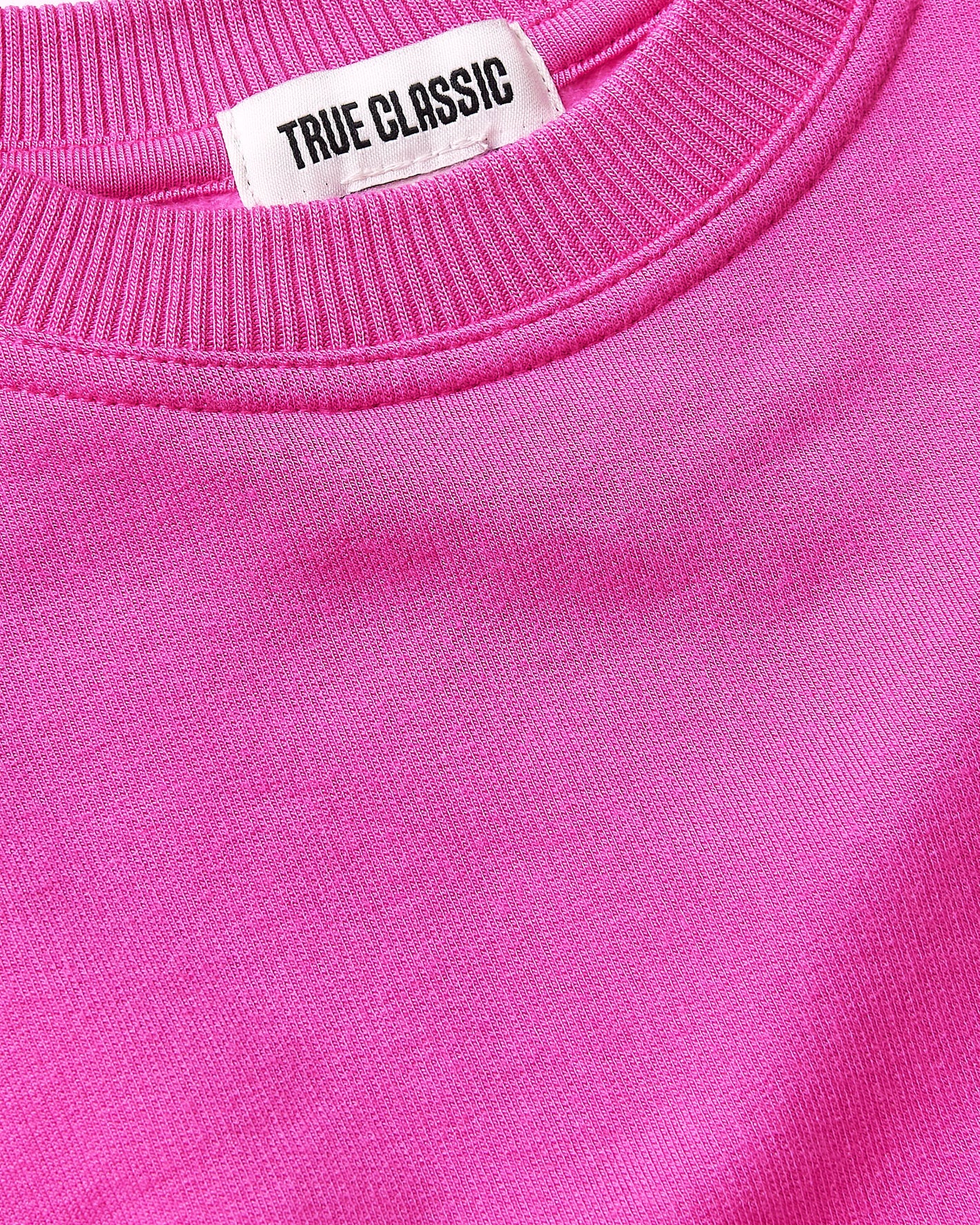 Girls Electric Fuchsia Slouch Pullover Crew with TRUE CLASSIC label at collar.