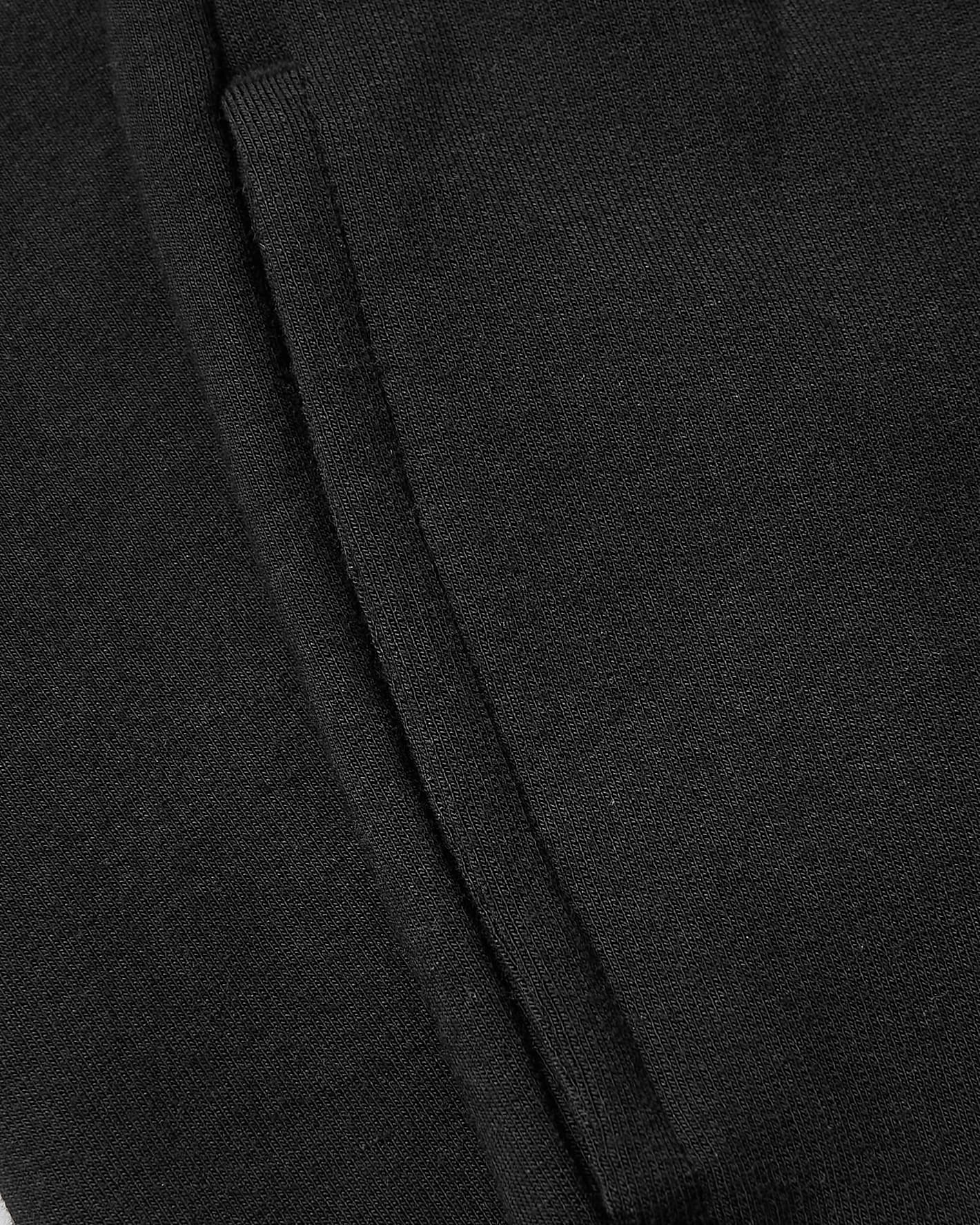 Black knit seam detail of Girls Deep Emerald & Black Relaxed Joggers 2-Pack.