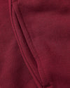 Girls Dark Maroon Cropped Zip Hoodie pocket detail with stitched edge.