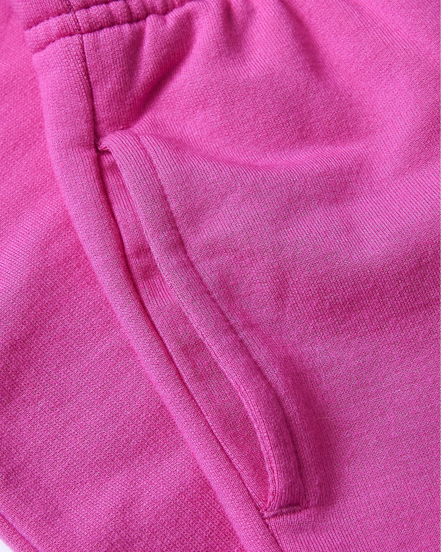 Girls Electric Fuchsia Cropped Zip Hoodie & Relaxed Joggers close-up: pocket, waistband.