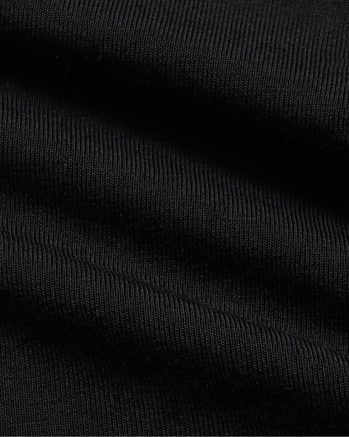 Close-up of Girls All Black Foldover Legging 2-Pack fabric texture.