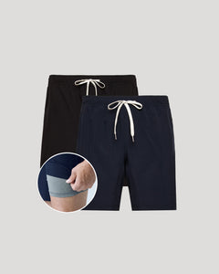 True ClassicTwo pairs of men's shorts, one black and one navy, with drawstrings on a light gray background.
