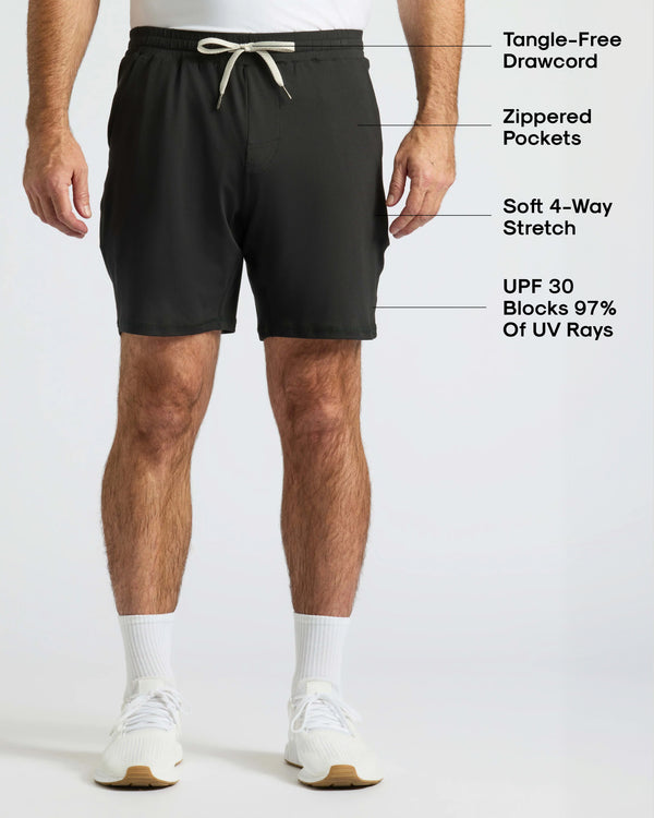 Basic Active Comfort Shorts 3-Pack modeled, featuring zip pockets and tangle-free drawcord.
