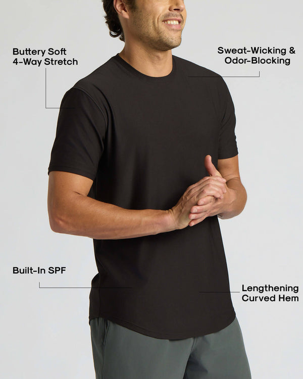 Man wearing an all black t-shirt highlighting features like buttery soft 4-way stretch, sweat-wicking and odor-blocking fabric, built-in SPF, and a lengthening curved hem in the All Black Active Curved Hem Crew 6-Pack.