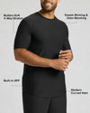 A man wearing a black short-sleeve athletic shirt with text callouts highlighting features such as buttery soft 4-way stretch, sweat-wicking and odor-blocking, built-in SPF, and modern curved hem.