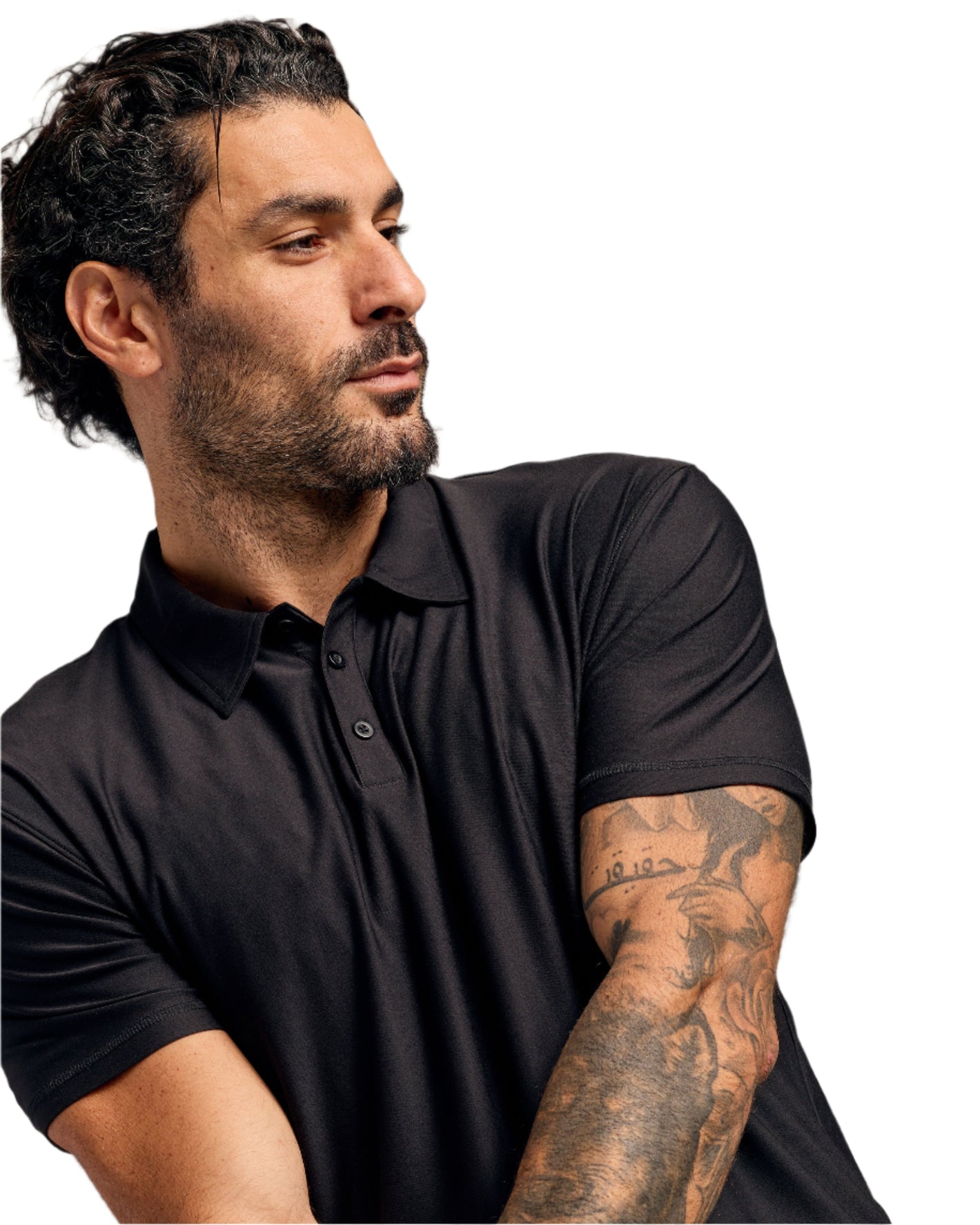 Man in Black Active Polo 6-Pack, showcasing tattoos on forearm.
