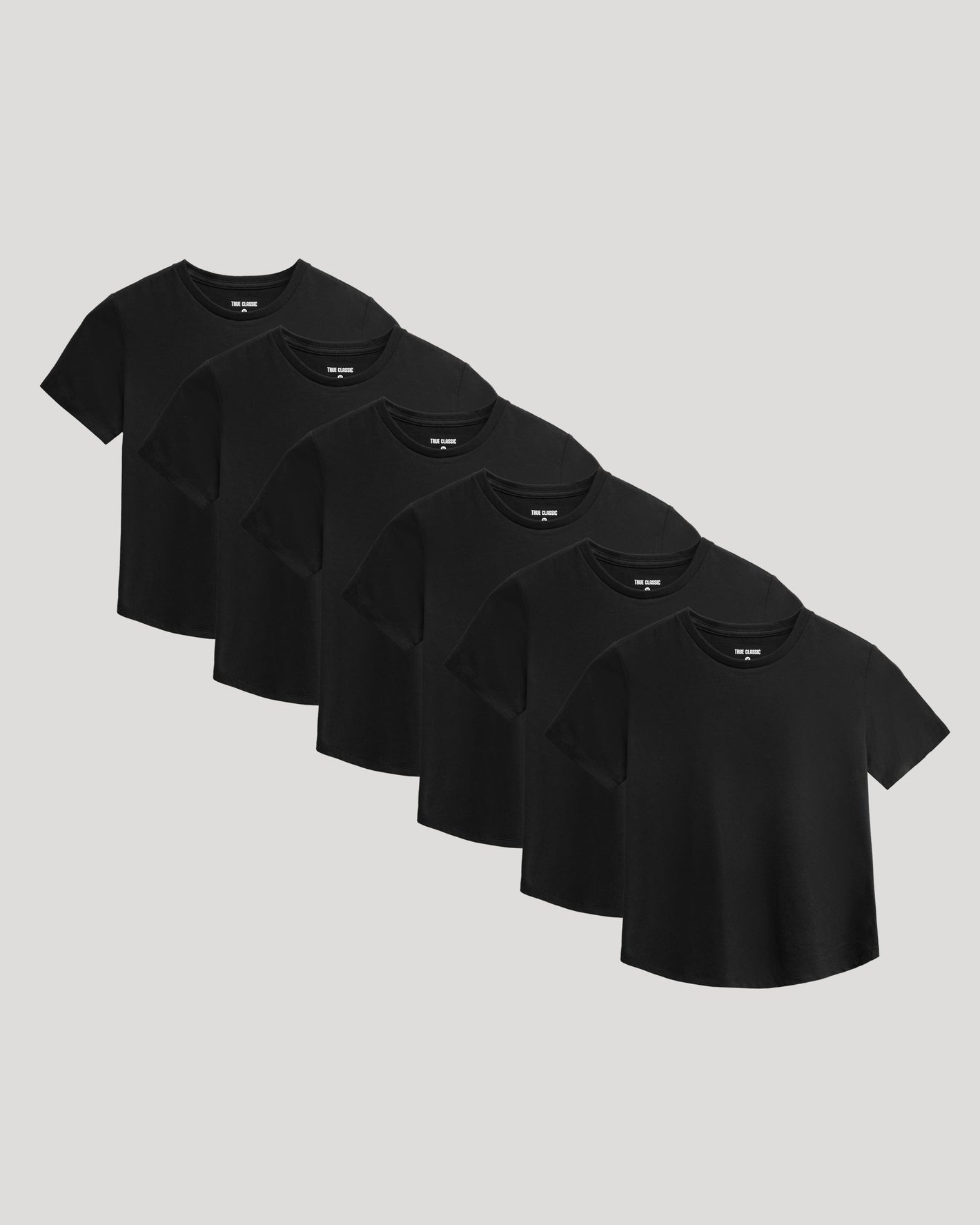 Boys' Classic Curved Hem Crew Neck 6-Pack arranged on grey surface.