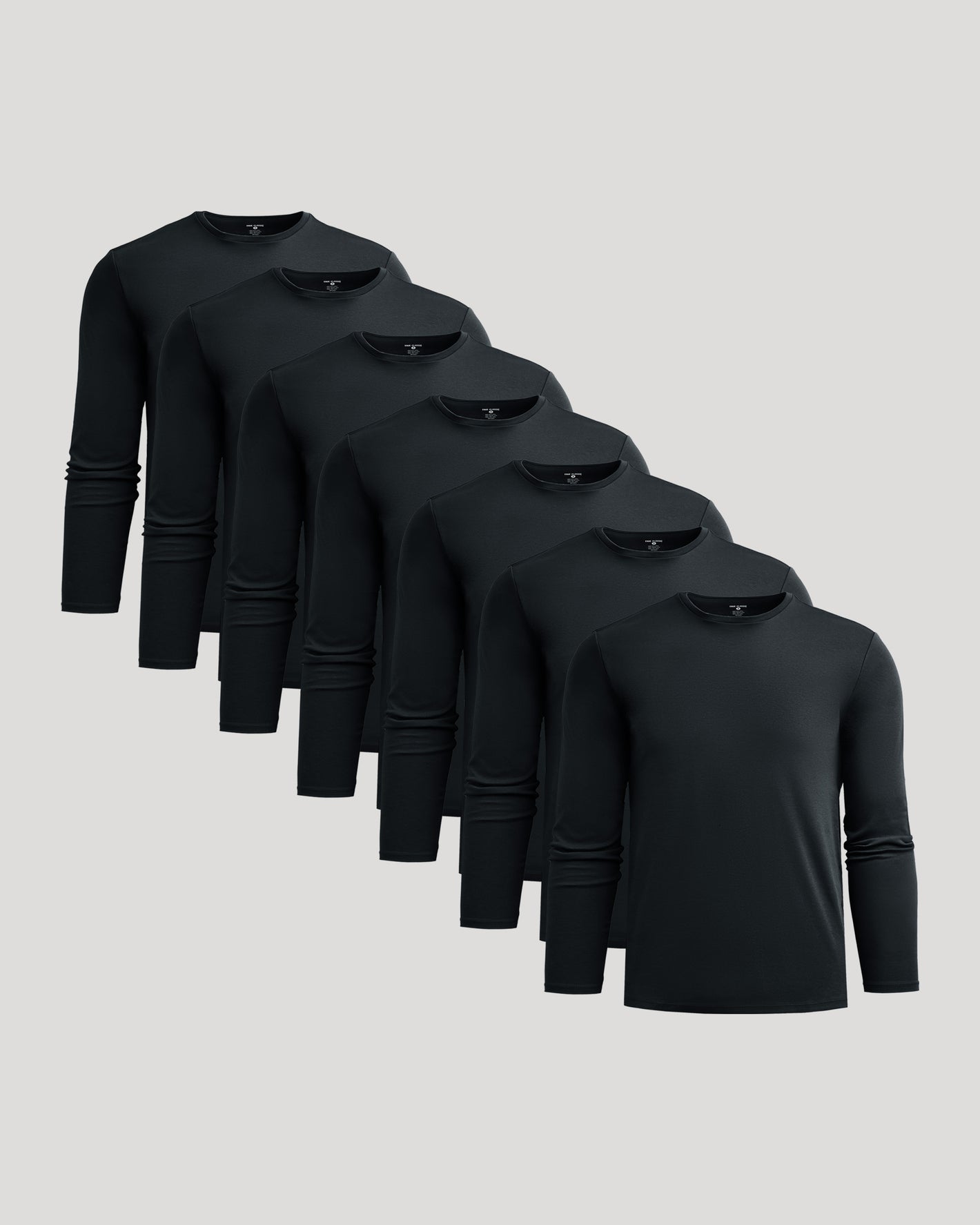 All Black Premium Pima Long Sleeve Crew 7-Pack arranged cascadingly.