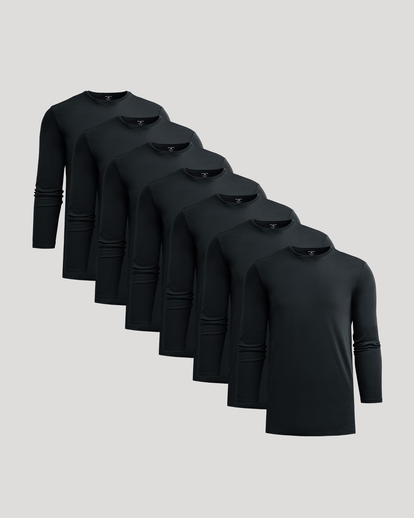 All Black Tall Premium Pima Long Sleeve Crew 7-Pack arranged diagonally.