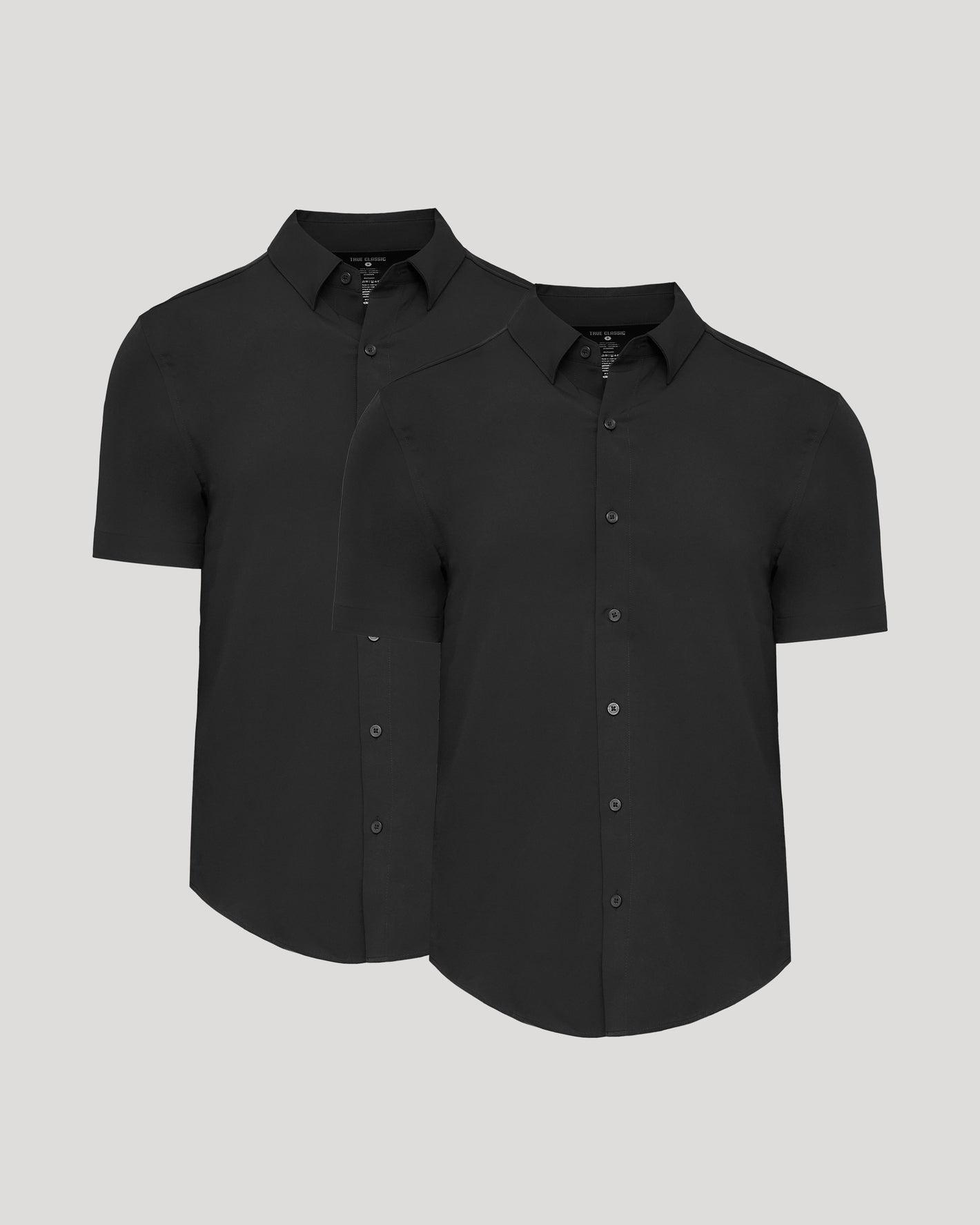 All Black Short Sleeve Performance Dress Shirt 2-Pack displayed overlapping.
