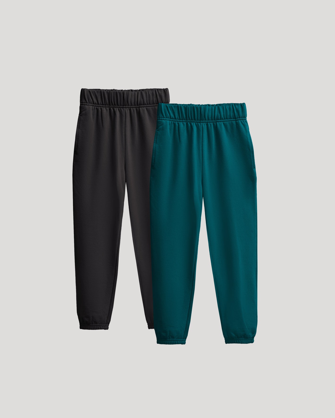 Girls Deep Emerald & Black Relaxed Joggers 2-Pack laid flat.