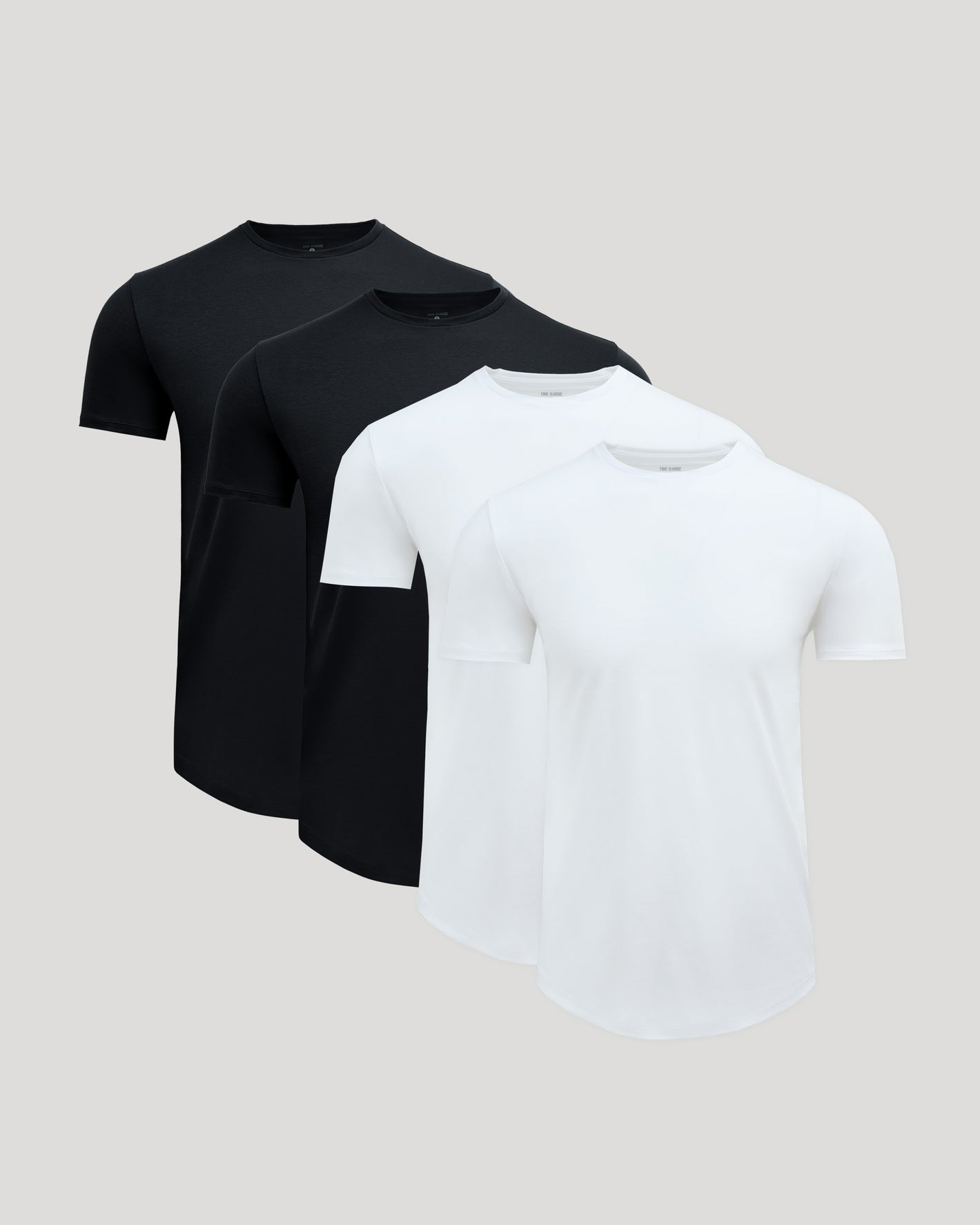 Black & White Premium Pima Crew Curved Hem 4-Pack, arranged on gray background.
