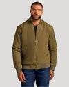 Man models Army Green Bomber Jacket & Comfort Stretch Jeans 2-Pack.