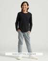 Boy wearing Boys' All Black Classic Long Sleeve Curved Hem Crew Neck.