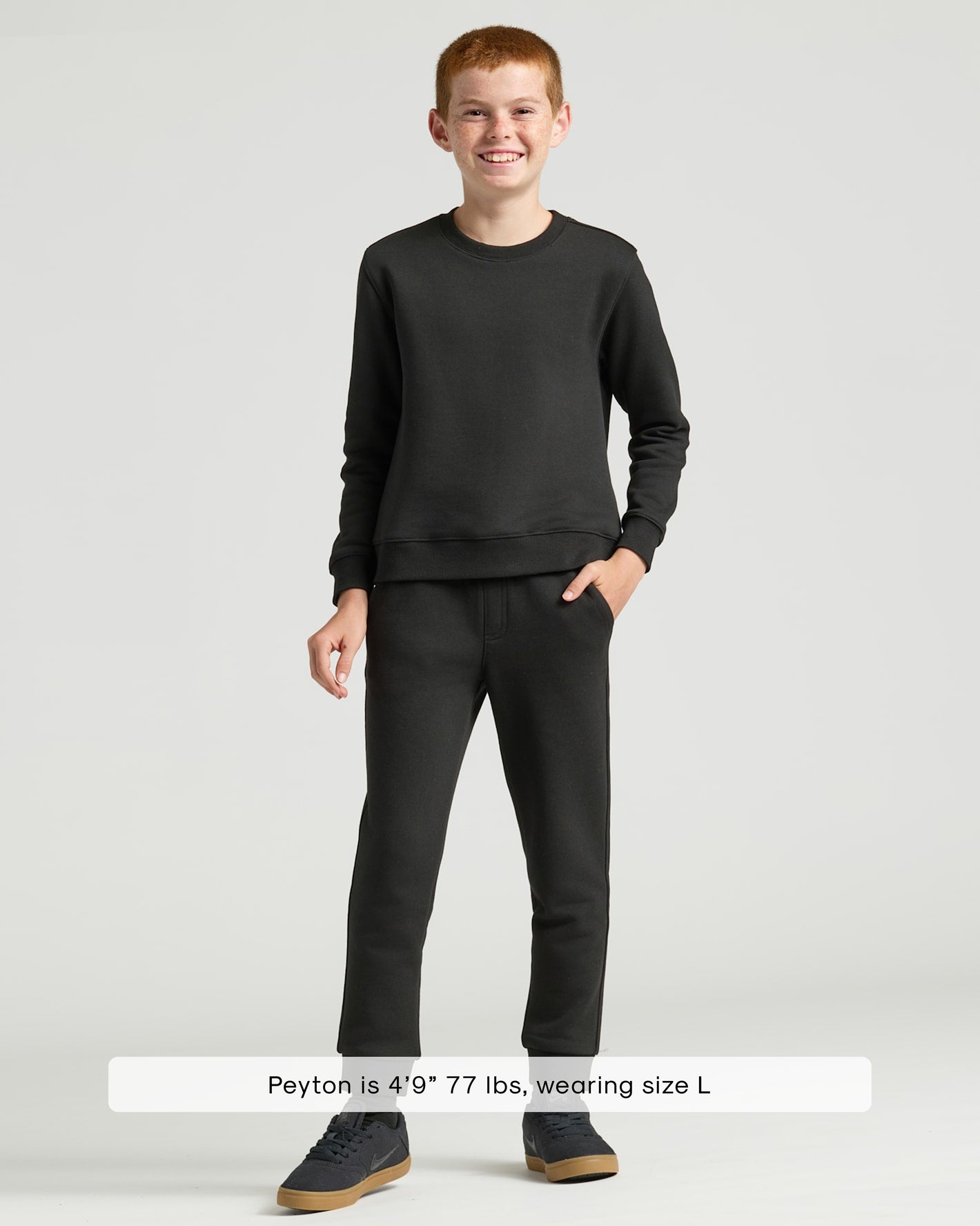 Boys' Black & Navy Fleece Joggers 2-Pack on smiling boy.
