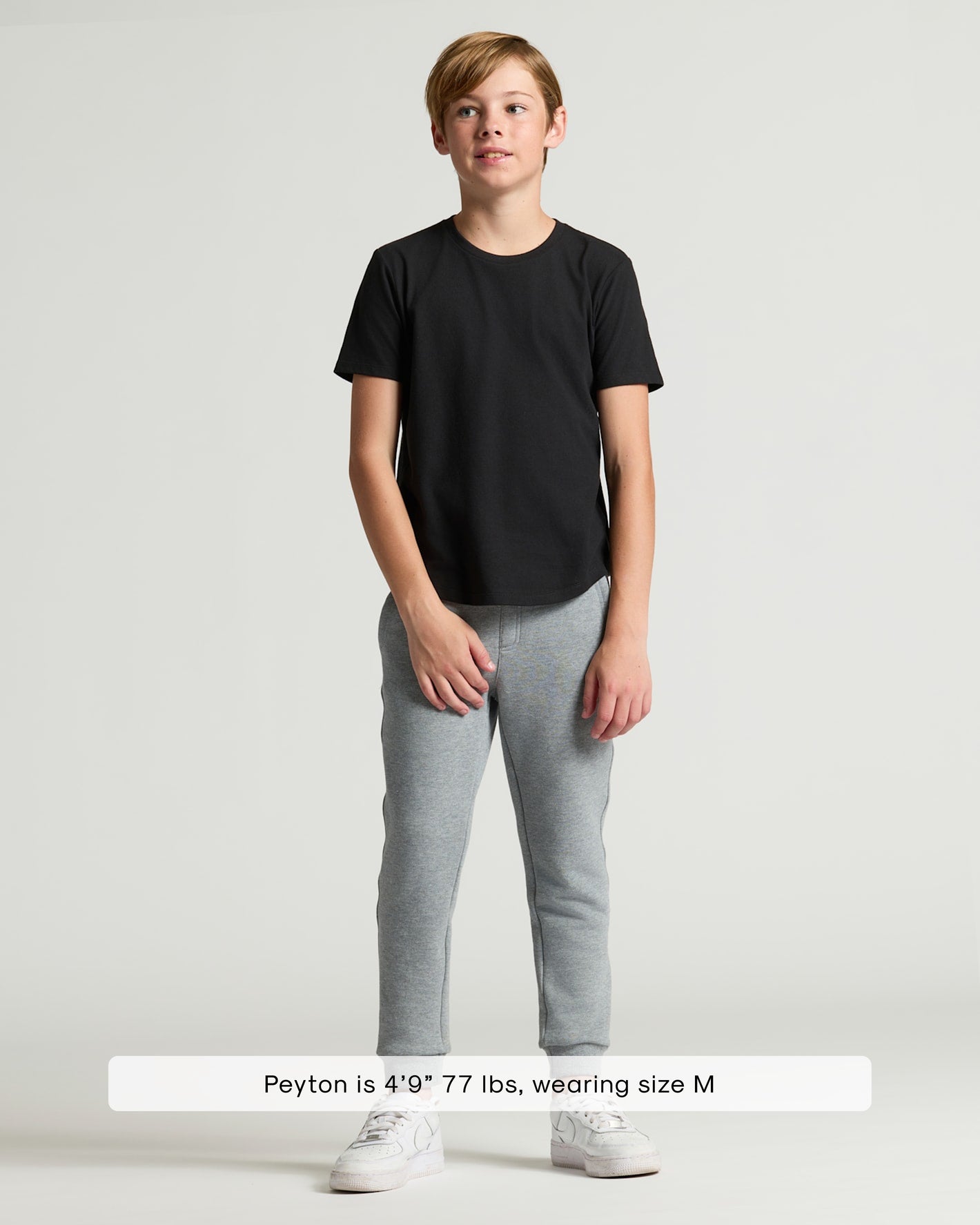 Boy wearing Boys' Classic Curved Hem Crew Neck 6-Pack, size M.