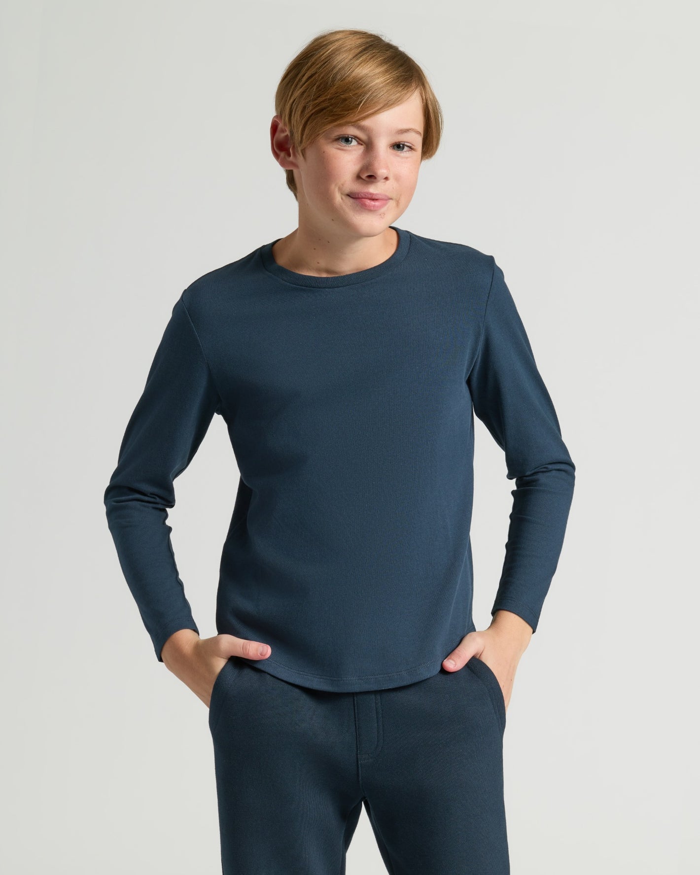 Young person in Boys' Classic Long Sleeve Curved Hem Crew Neck.