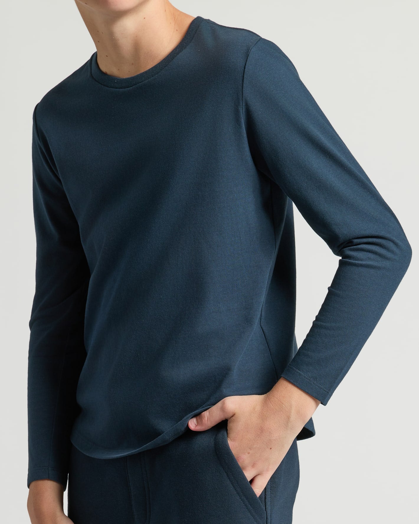 Boy wearing Boys' Navy Classic Long Sleeve Curved Hem Crew set.