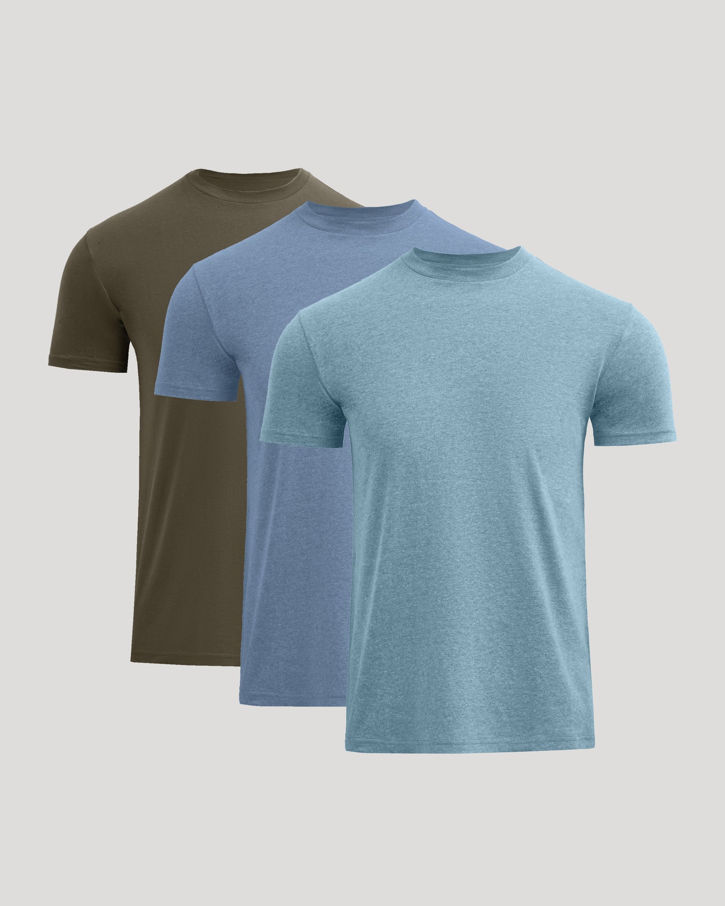 Three men's t-shirts in green, blue, and gray on a light gray background