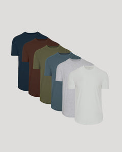 True ClassicSix-pack crew neck t-shirts in navy, brown, olive, slate blue, light gray, and white with curved hems.