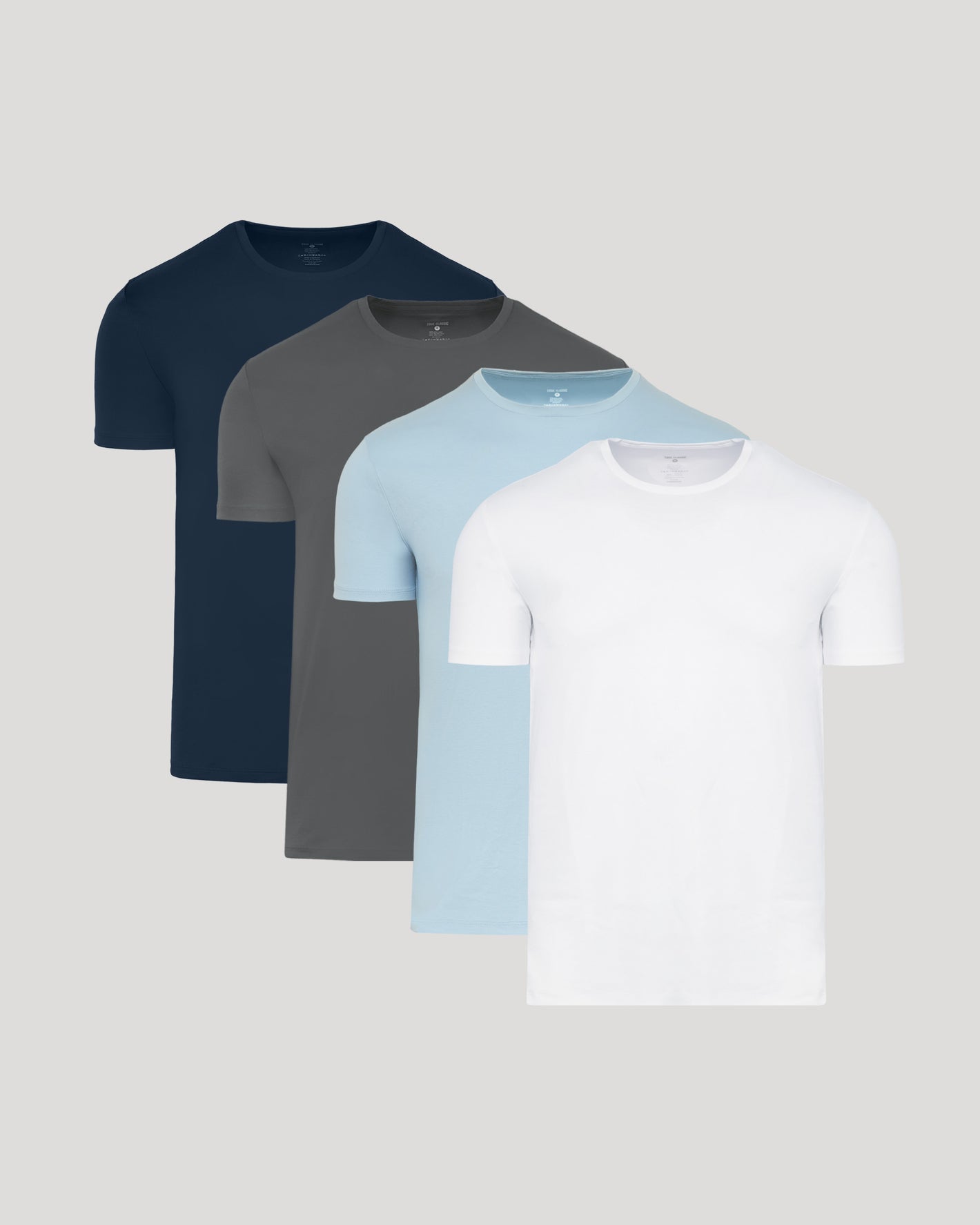 The Standard Premium Pima Crew Neck 4-Pack T-shirts stacked neatly.