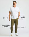 Man wearing Military Green Fleece French Terry Joggers with sneakers.