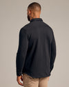 Black Fleece Shirt Jacket with buttoned cuffs and visible neck tattoo.