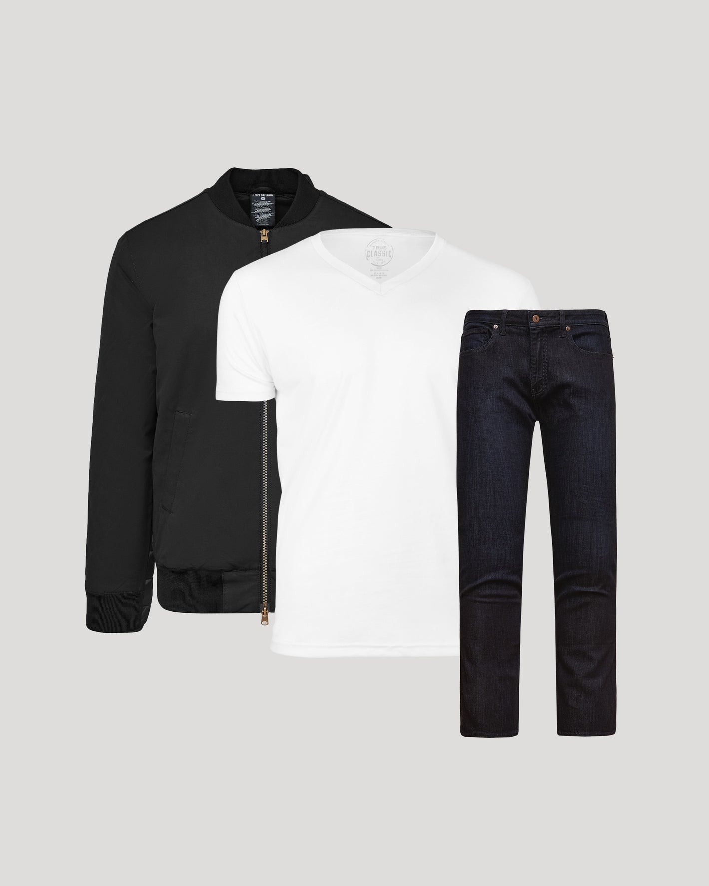The Effortless Pack: black bomber, white V-neck tee, indigo jeans.