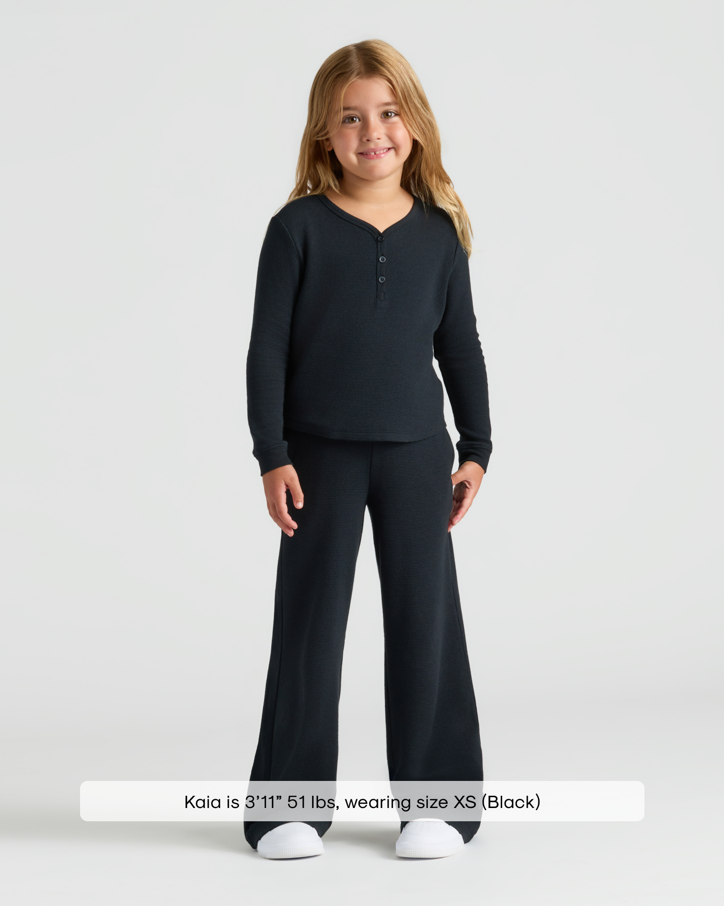 Girl in Girls Black Long Sleeve Boxy Waffle Henley outfit.