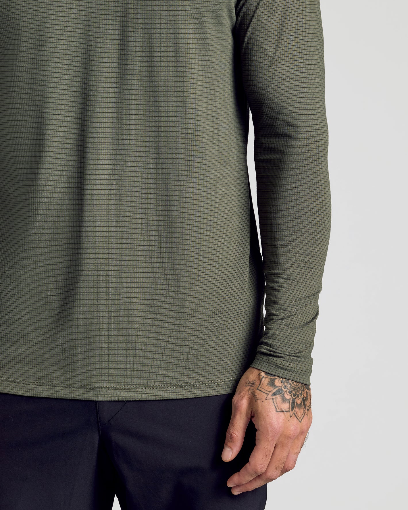 Kelp Long Sleeve Active Mesh Crew on person with tattooed hand.
