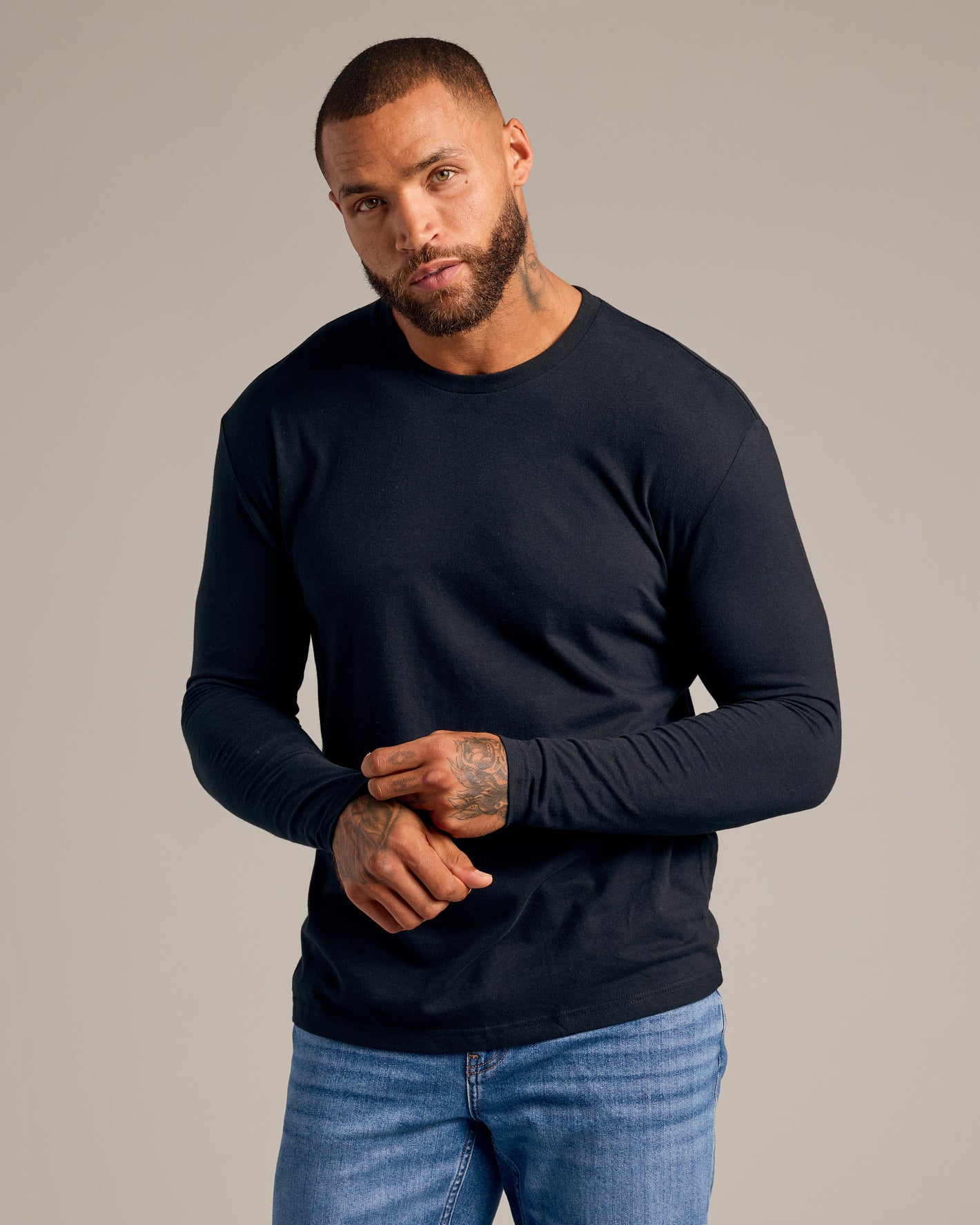 Black Classic Long Sleeve Crew Neck 6-Pack worn by tattooed man.