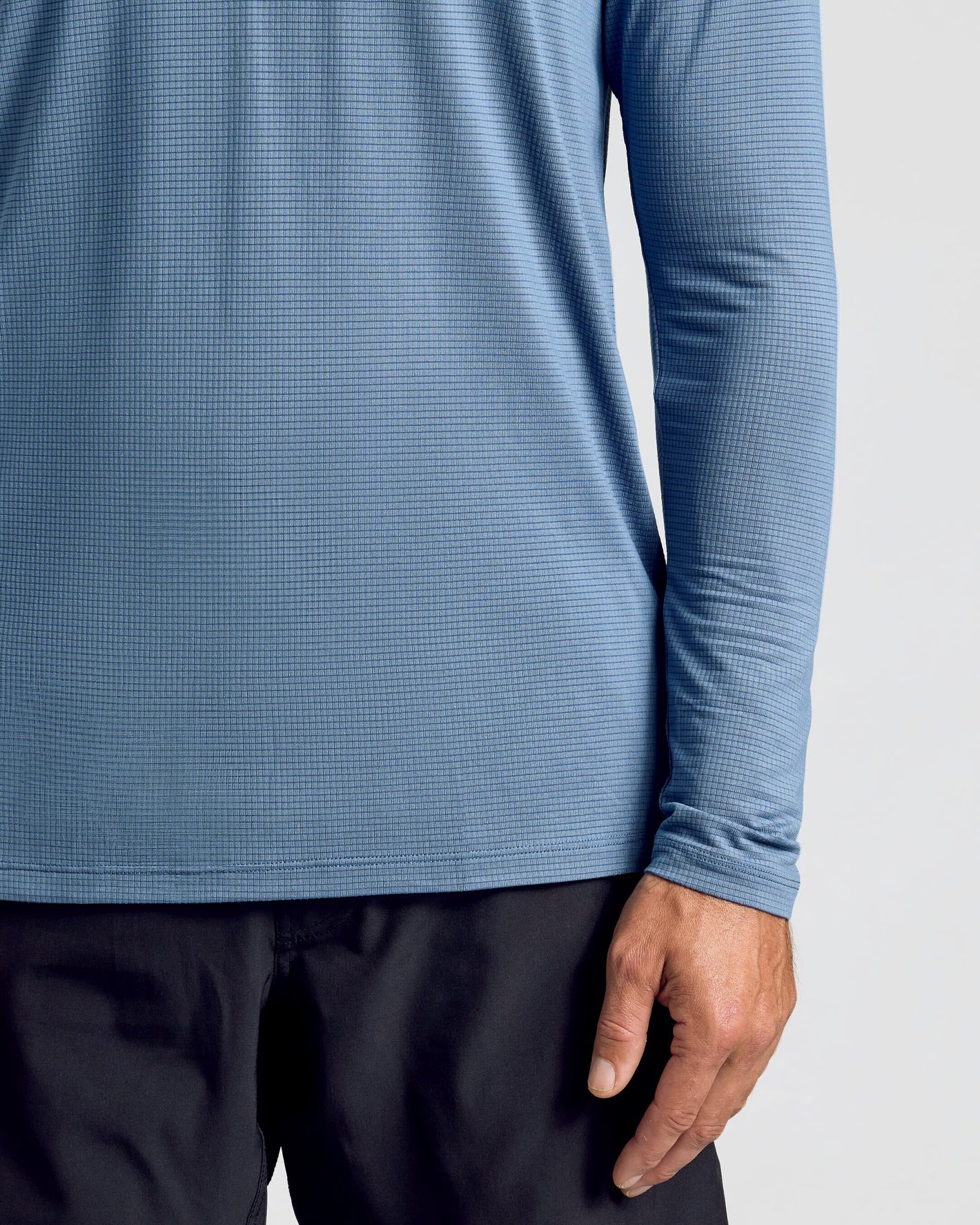 Person in Fiord Long Sleeve Active Mesh Crew with black pants.