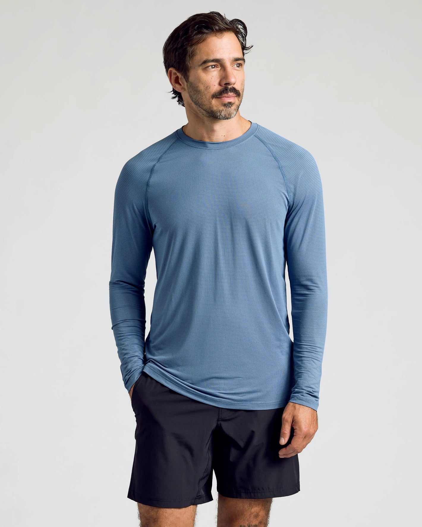 Fiord Long Sleeve Active Mesh Crew worn by model with hands in pockets.